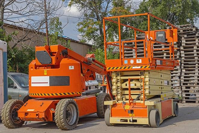 industrial forklift lifting heavy loads in warehouse in Covina